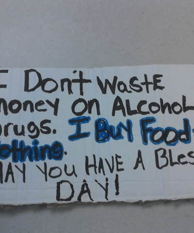 Reads: I don't waste money on alcohol or drugs. I buy food and clothing. May you have a blessed day!