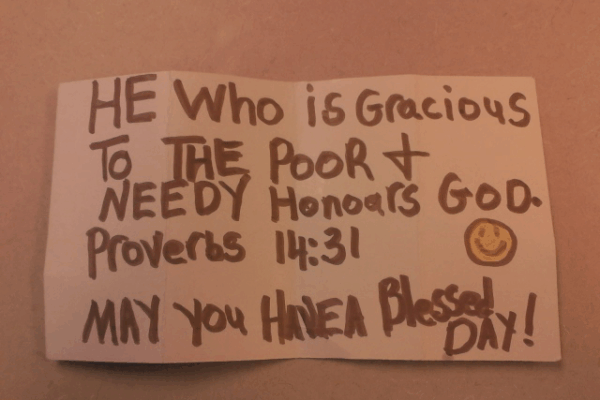 Reads: he who is gracious to the poor & needy honors god. Proverbs 14:13 :) May you have a blessed day!