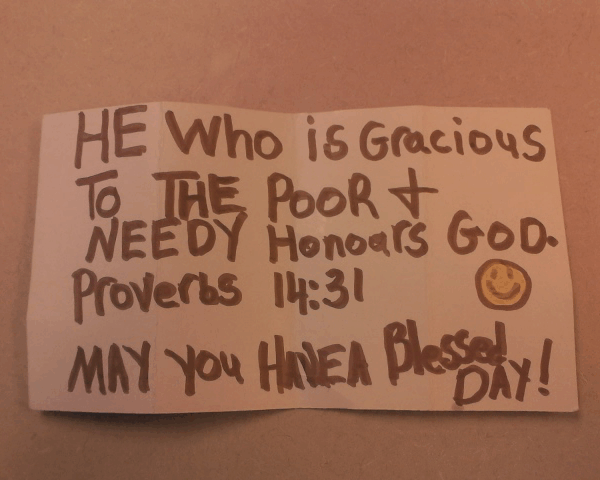 Reads: he who is gracious to the poor & needy honors god. Proverbs 14:13 :) May you have a blessed day!