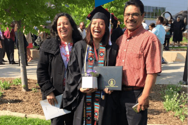 Photo of Maria and her family at her college graduation