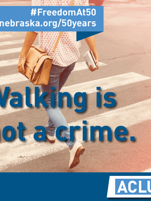 Woman walking down street with text "walking is not a crime"