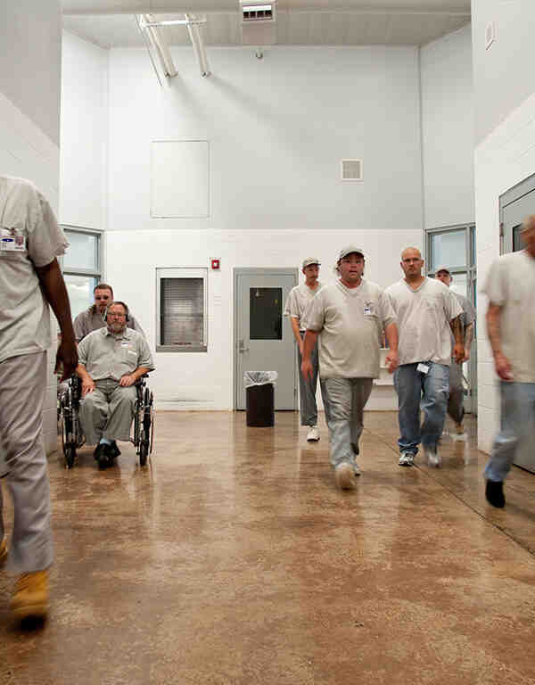 Photo of prisoners in a hallway