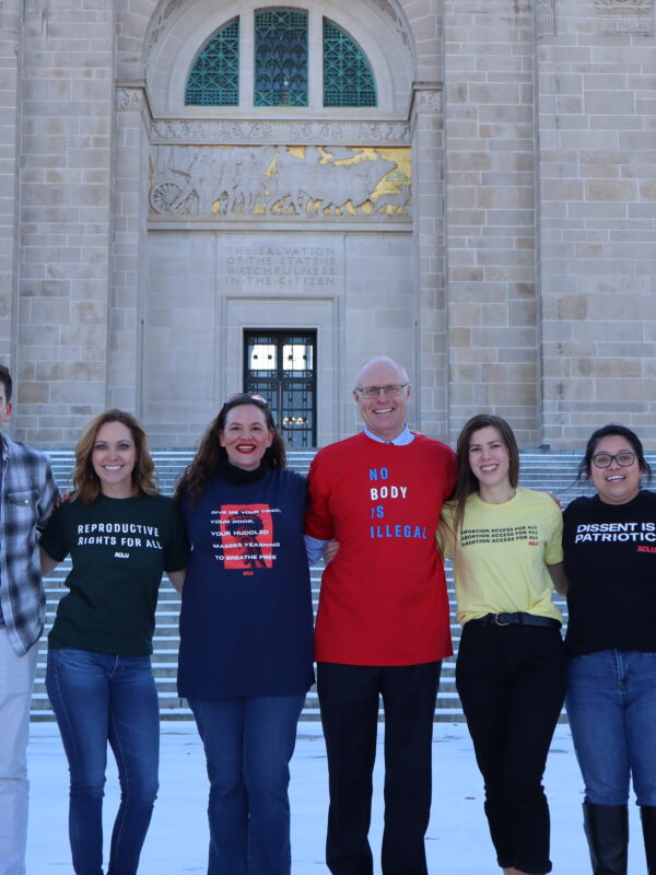 The ACLU of Nebraska team stands in front of the Capitol.