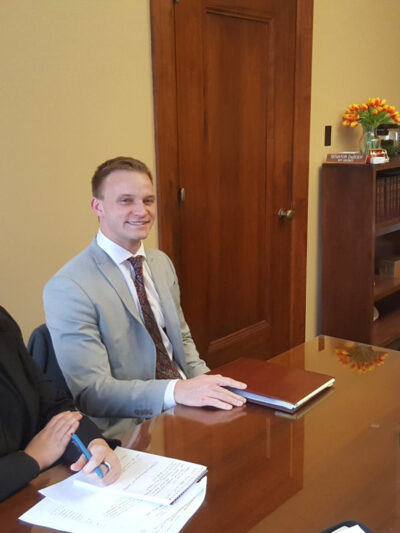 Nebraska Law Civil Clinic students Erin Olsen, an ACLU law clerk, and Josh Waltjer meet with Senator Wendy DeBoer to discuss a bill the Senator has introduced to clarify Nebraska's conviction set-aside law.