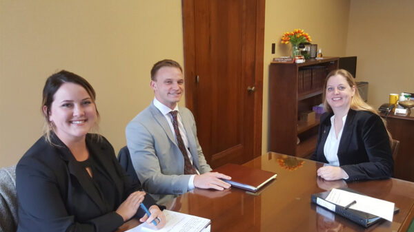 Nebraska Law Civil Clinic students Erin Olsen, an ACLU law clerk, and Josh Waltjer meet with Senator Wendy DeBoer to discuss a bill the Senator has introduced to clarify Nebraska's conviction set-aside law.