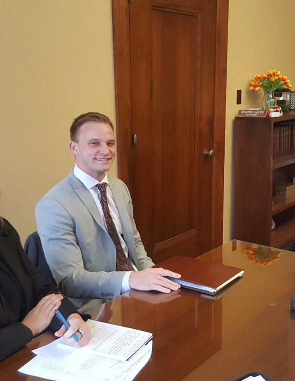Nebraska Law Civil Clinic students Erin Olsen, an ACLU law clerk, and Josh Waltjer meet with Senator Wendy DeBoer to discuss a bill the Senator has introduced to clarify Nebraska's conviction set-aside law.