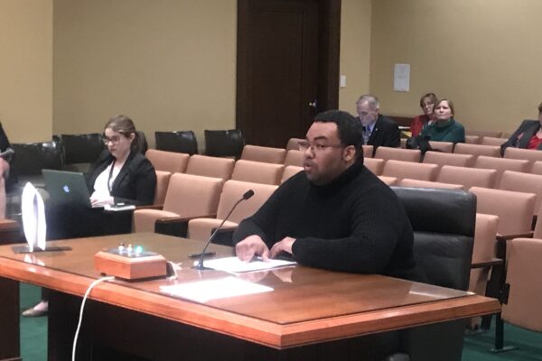 Andrew Aleman testifies at a committee hearing.