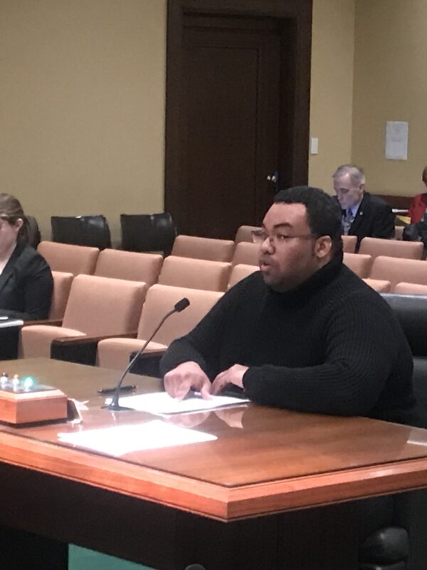 Andrew Aleman testifies at a committee hearing.