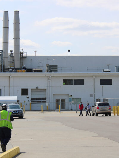 Two workers walk toward the Tyson Foods processing plant in Dakota City, Nebraska.