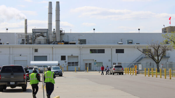 Two workers walk toward the Tyson Foods processing plant in Dakota City, Nebraska.