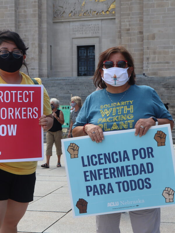 ACLU Legal & Policy Counsel Rose Godinez stands next to ACLU Board Member Yolanda Nuncio at a demonstration in support of essential workers.
