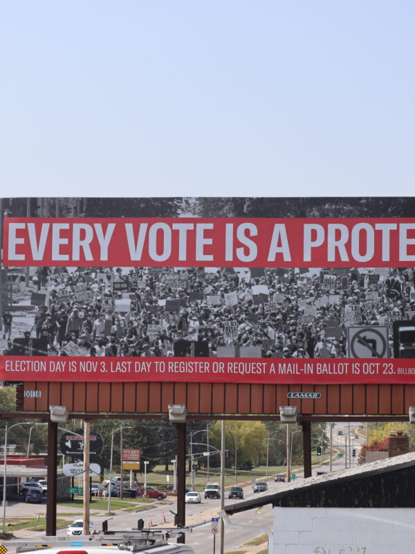 A billboard in Omaha reads "Every Vote is a Protest"
