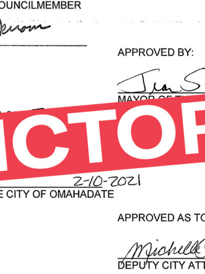 A graphic showing a signature on paperwork with "VICTORY" superimposed over it.