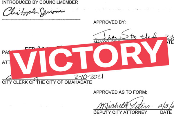 A graphic showing a signature on paperwork with "VICTORY" superimposed over it.