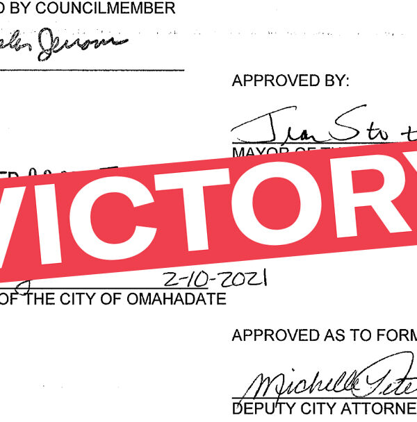A graphic showing a signature on paperwork with "VICTORY" superimposed over it.