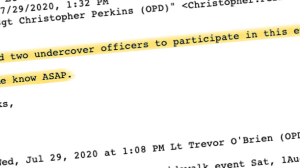 An excerpt of a highlighted email reading "I need two undercover officers to participate in this event"