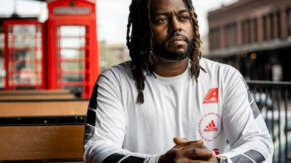 Jason Storrs sits outside in Omaha. Photograph taken by Abiola Kosoko.