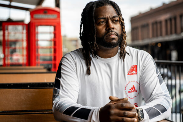 Jason Storrs sits outside in Omaha. Photograph taken by Abiola Kosoko.