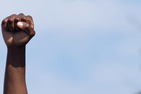 A man holds a fist in the air during a Nebraska protest following the killing of George Floyd.