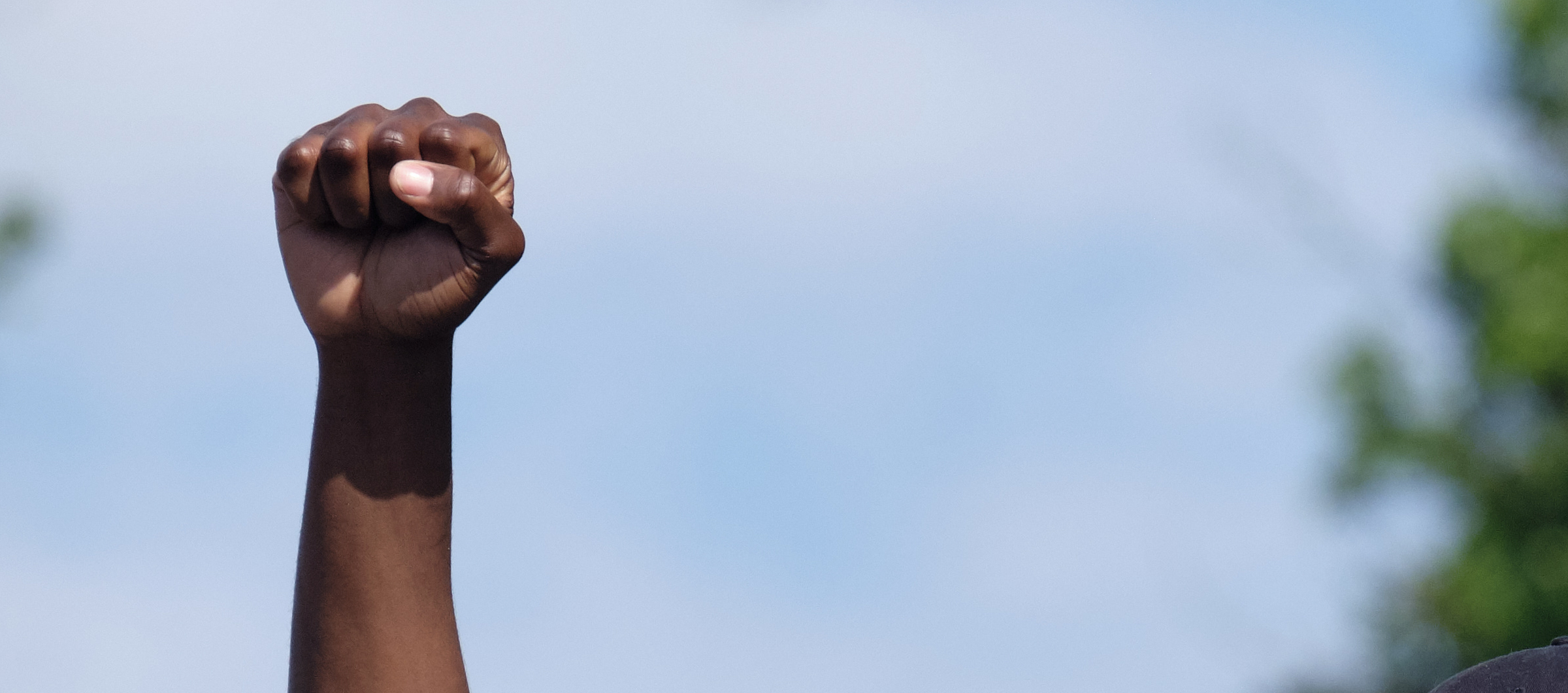A man holds a fist in the air during a Nebraska protest following the killing of George Floyd.