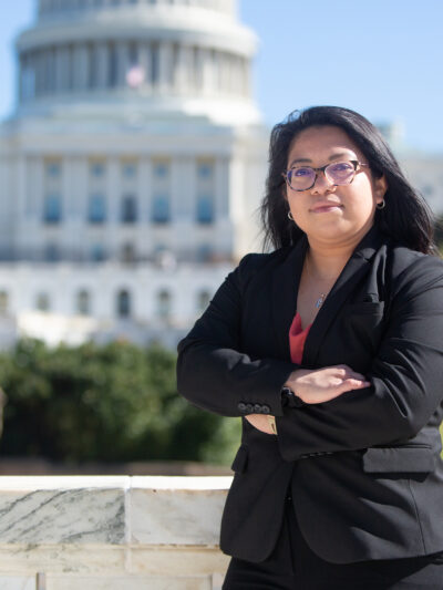 ACLU of Nebraska Interim Legal Director Rose Godinez stands outside the Capitol building.