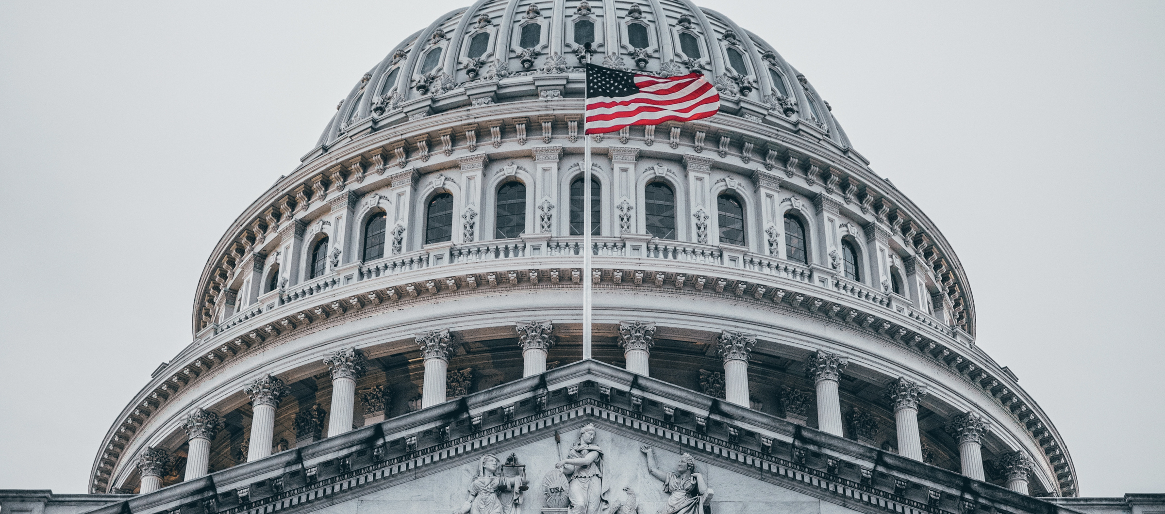 The American flag flies over the U.S. Capitol.