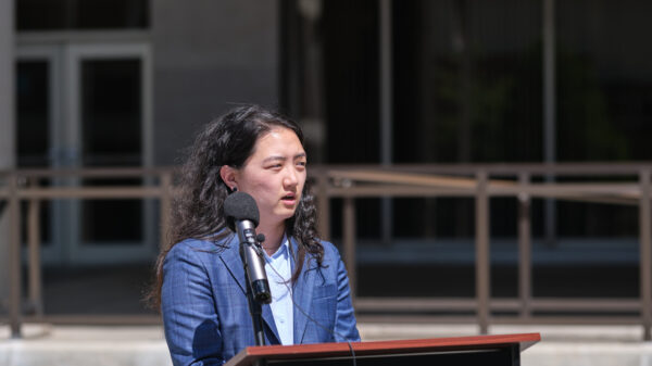 ACLU of Nebraska attorney Jane Seu speaks at a press conference announcing a lawsuit challenging Nebraska's unconstitutional multicounty distribution requirement.