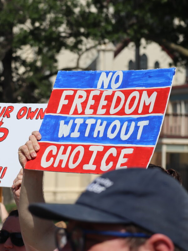 Nebraskans hold protest signs at an abortion rights rally in Lincoln.