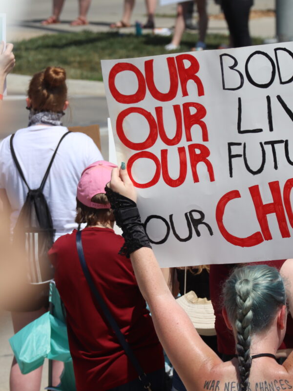 A sign reads our bodies, our lives, our futures, our choice at a July 4 abortion rights rally in Lincoln.