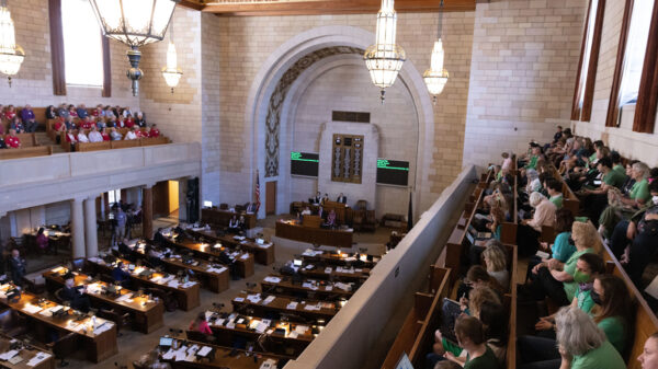Abortion rights supporters watch debate on abortion ban LB 626 during its first round of debate.