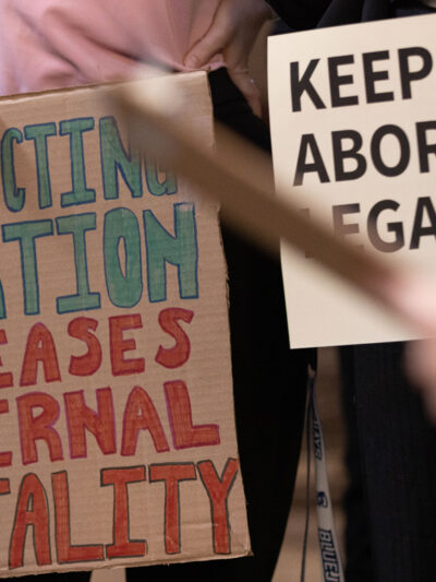 Nebraskans hold signs in support of abortion rights ahead of a committee hearing on six-week abortion ban LB 626.