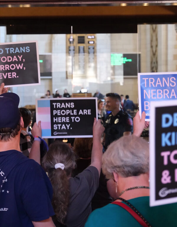 Nebraskans gather in the Capitol to tell state senators to protect trans youth and reject LB 574.