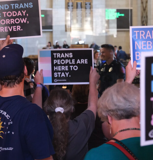 Nebraskans gather in the Capitol to tell state senators to protect trans youth and reject LB 574.