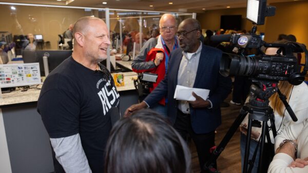 Omahan Jason Kotas talks with reporters after registering to vote a few hours after the Nebraska Supreme Court issued its ruling.