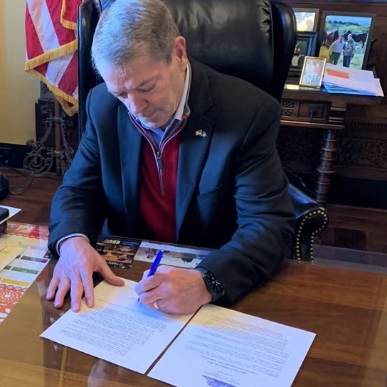 Gov. Jim Pillen signs his executive order directing state agencies to ensure they are supporting federal immigration directives.