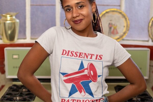 A woman wears a shirt reading dissent is patriotic