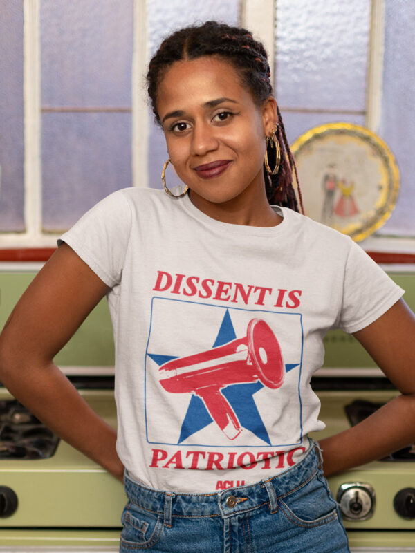 A woman wears a shirt reading dissent is patriotic