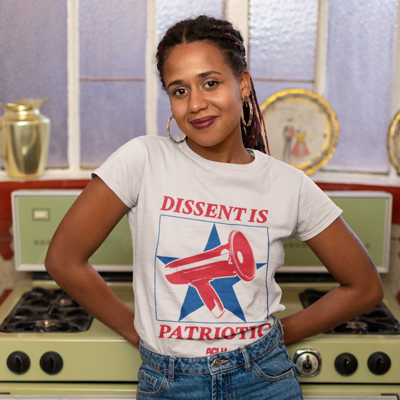 A woman wears a shirt reading dissent is patriotic