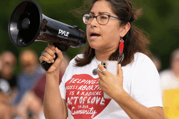 A woman speaks at an Omaha rally following the fall of Roe v Wade.