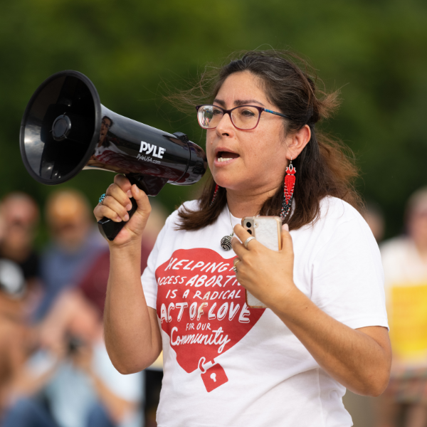 A woman speaks at an Omaha rally following the fall of Roe v Wade.