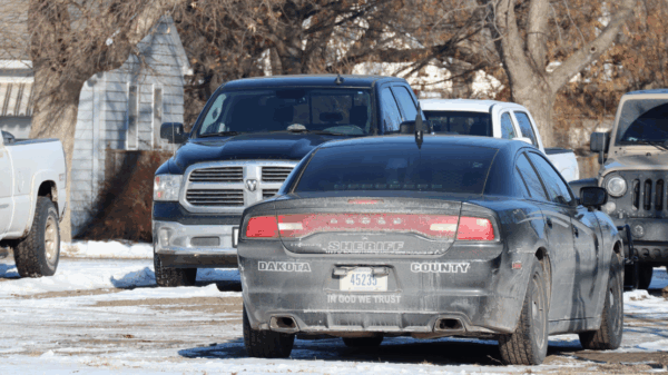 An image of a Dakota County cruiser. The back reads "In God We Trust"