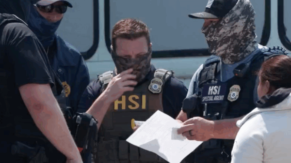 ICE agents talk outside of