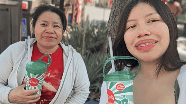 Maria Reynosa Jacinto, an ACLU client, and her daughter Andrea take a photograph on a family trip.