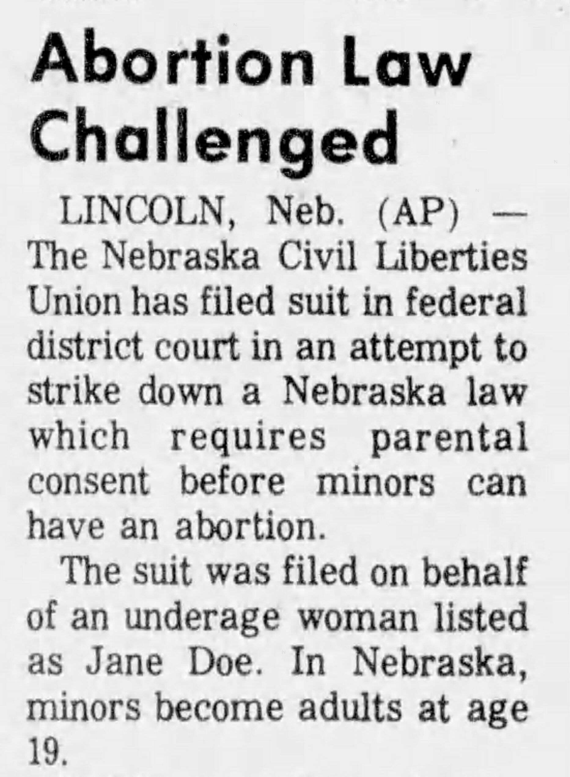 A newspaper article reads Abortion Law Challenged.