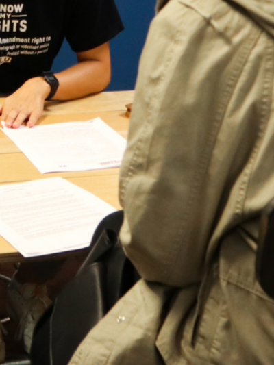A team member assists with legal intake at a community event in Omaha.