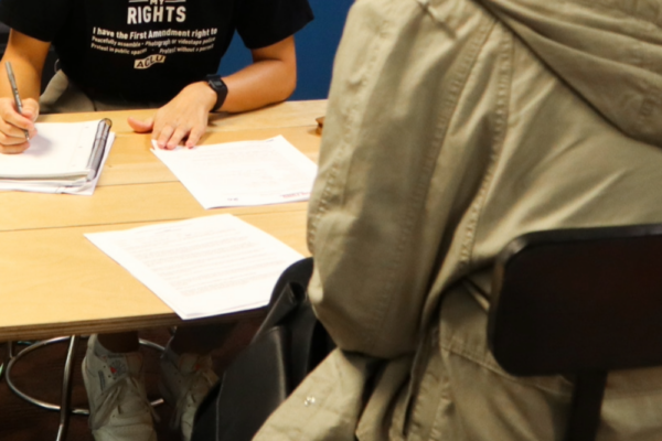 A team member assists with legal intake at a community event in Omaha.