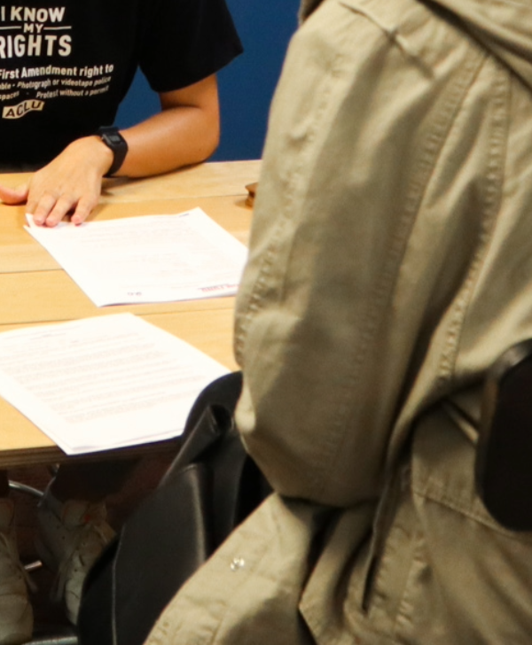 A team member assists with legal intake at a community event in Omaha.