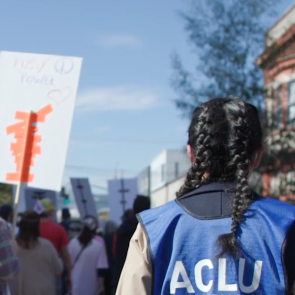 A photograph shows an ACLU legal observer in action. Courtesy ACLU of Oregon.