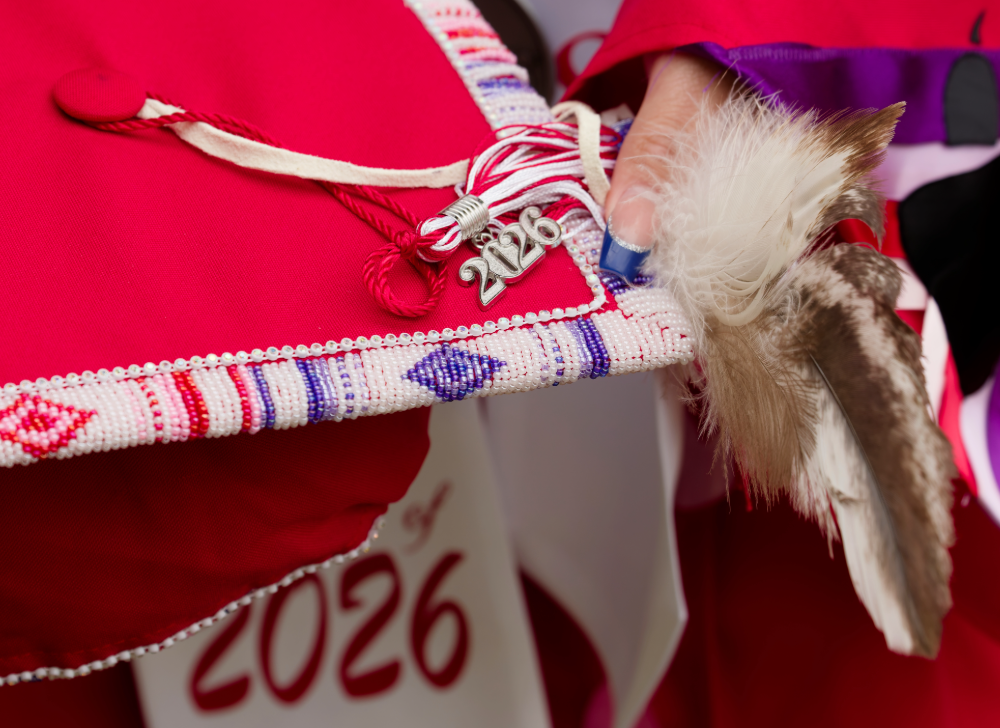 Luong's beaded cap was adorned with an eagle feather and plume.