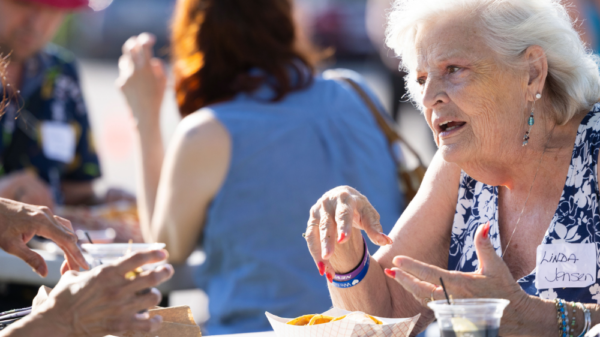 ACLU of Nebraska supporters talk over a meal at a May 2026 event.